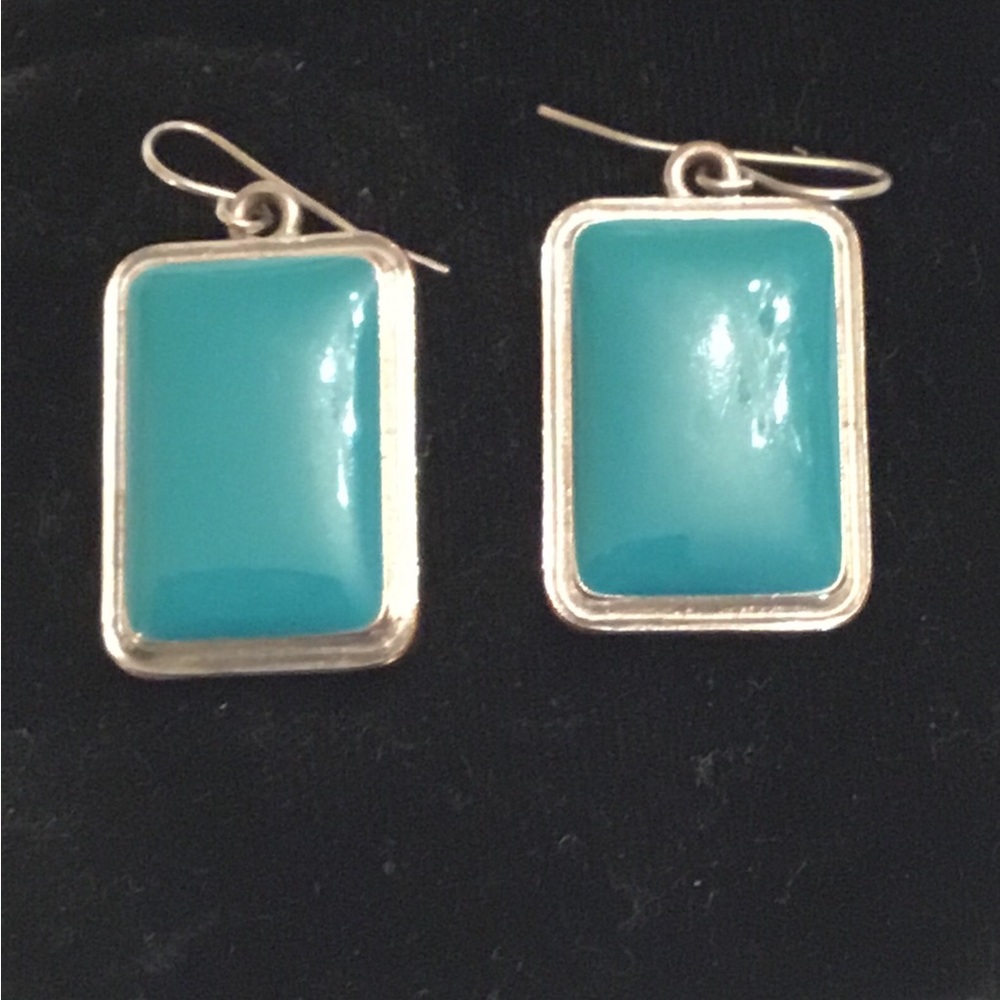 Geometric rectangular earrings in silver and turquoise colors.